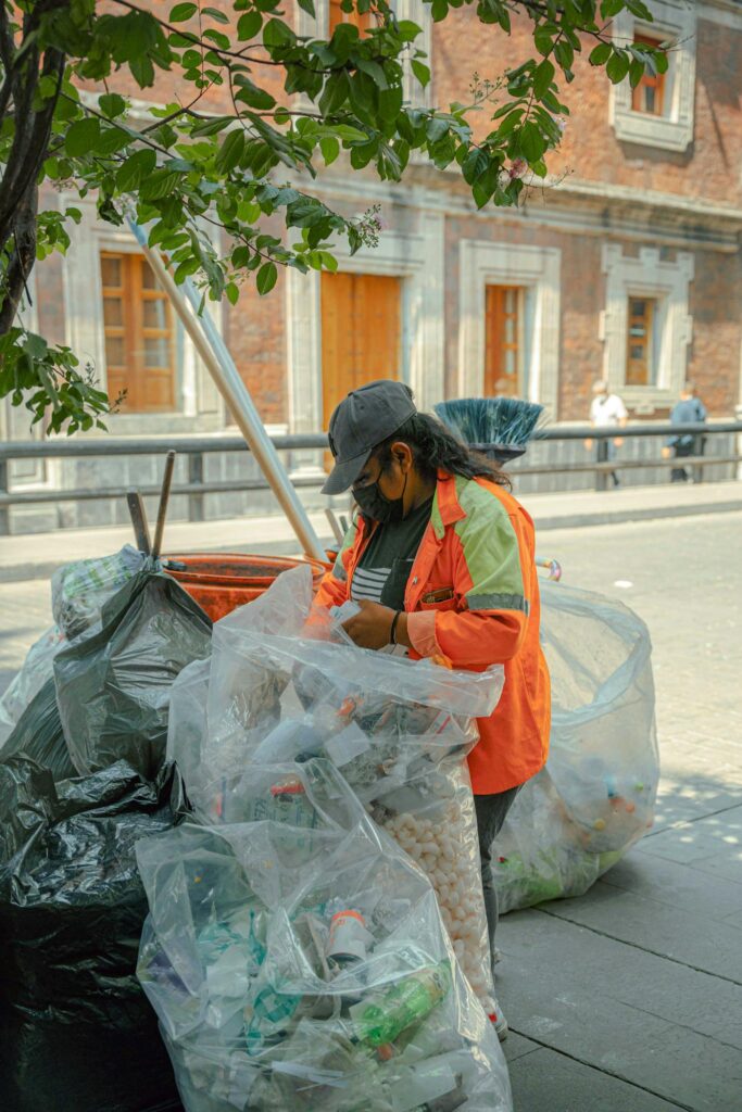 A worker sorting trash for junk removal